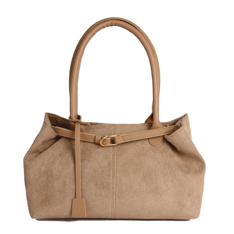 Brown handbag with a strap on a white background