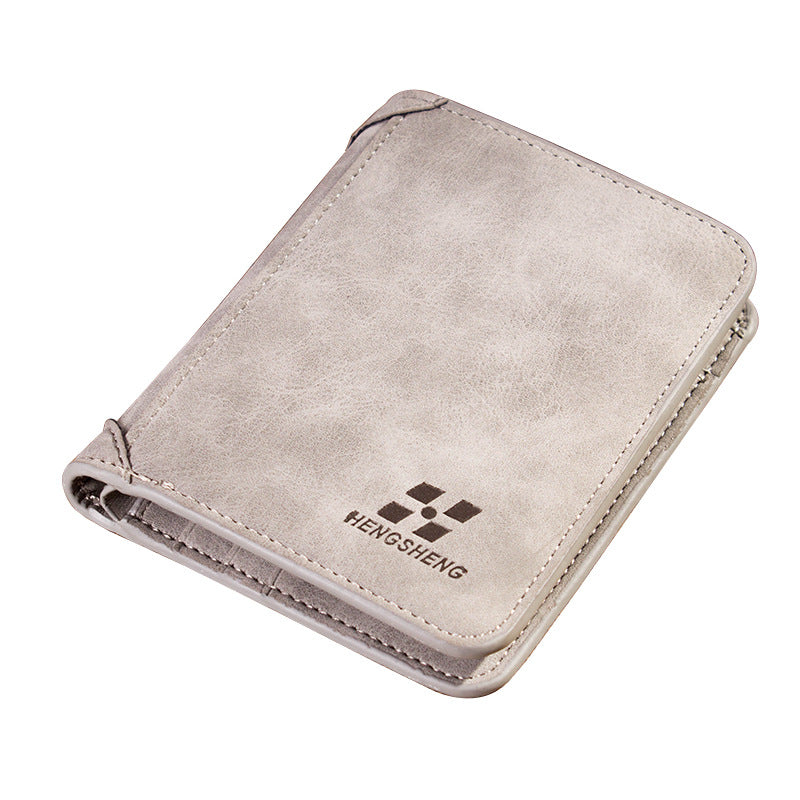 Beige wallet with a brand logo on a white background