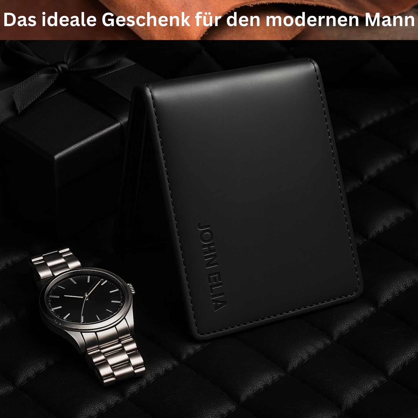 Black wallet and silver watch on a dark textured surface with text 'Das ideale Geschenk für den modernen Mann'.
