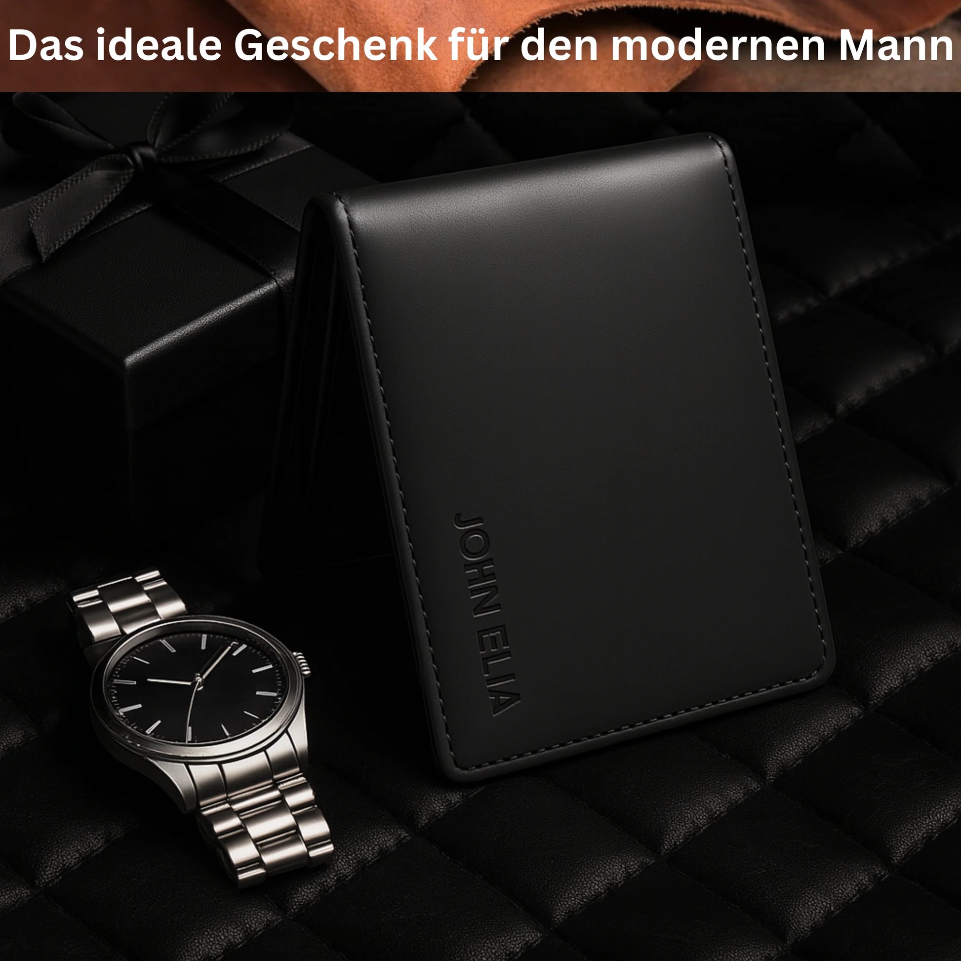 Black wallet and silver watch on a dark textured surface with text 'Das ideale Geschenk für den modernen Mann'.